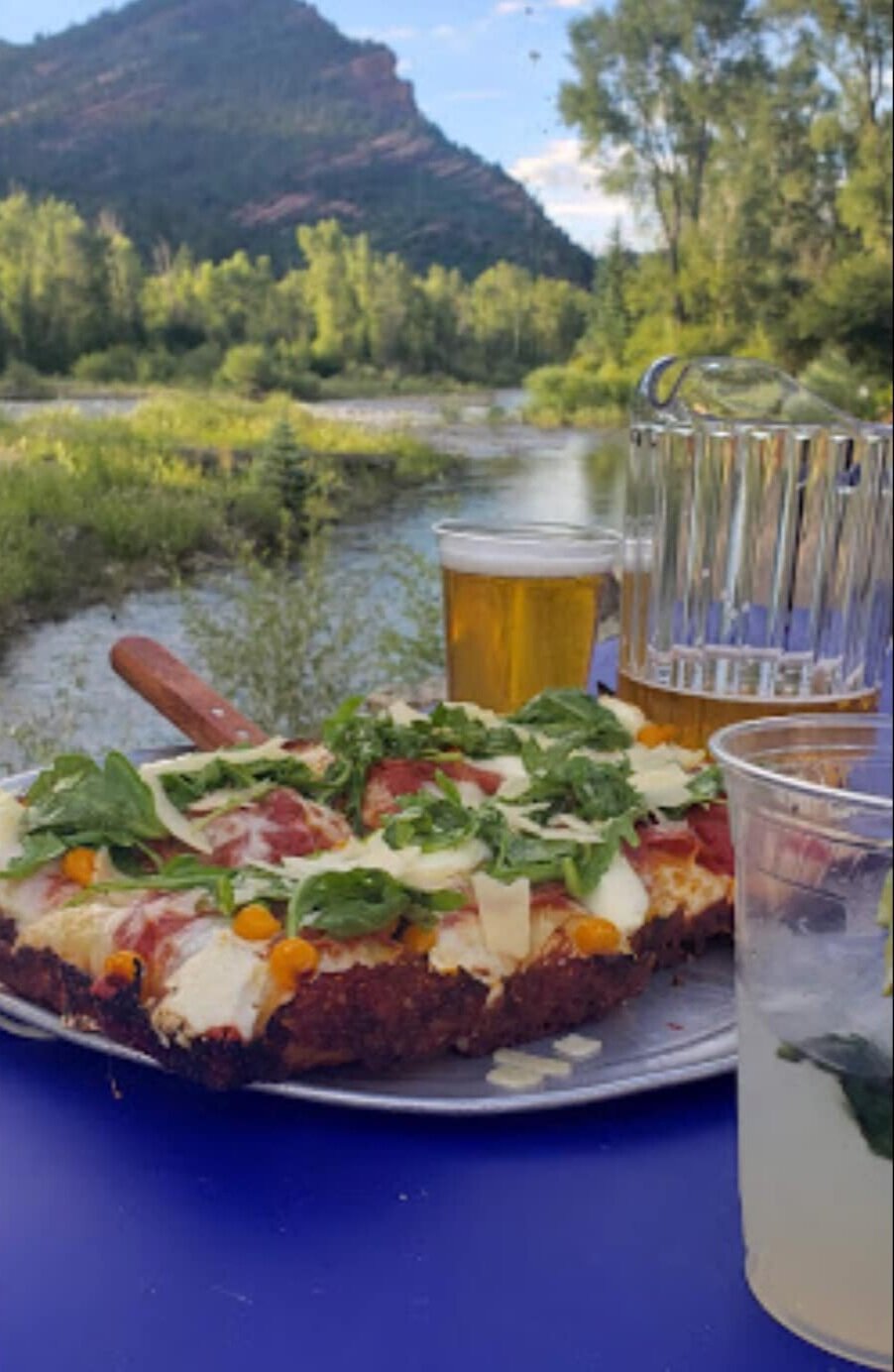Dinner and a view with pizza, a pitcher of beer and a cocktail overlooking the Crystal River from Propaganda Pie